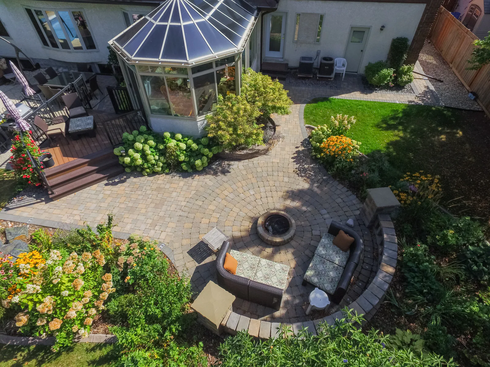 Circular paver patio with a built-in fire pit