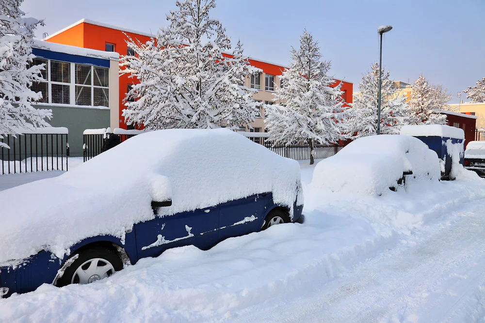 Vehicles buried by a heavy Winnipeg snowfall