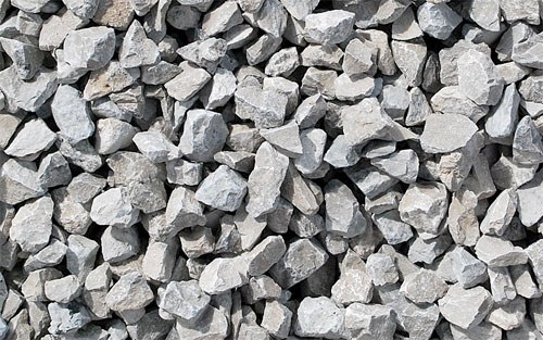 A close-up view of crushed gray limestone pieces.